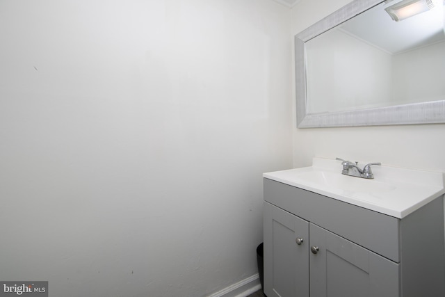 bathroom with vanity and baseboards