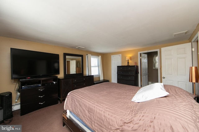 carpeted bedroom featuring visible vents