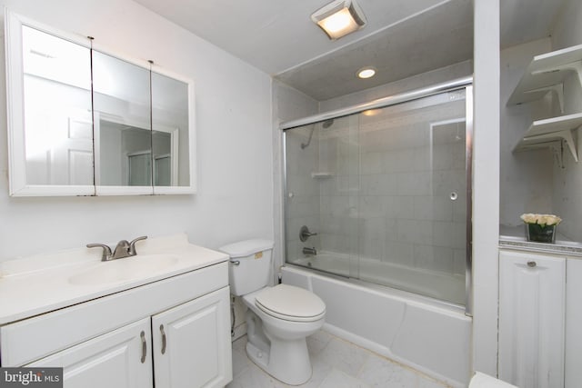 full bathroom with toilet, bath / shower combo with glass door, vanity, and tile patterned floors