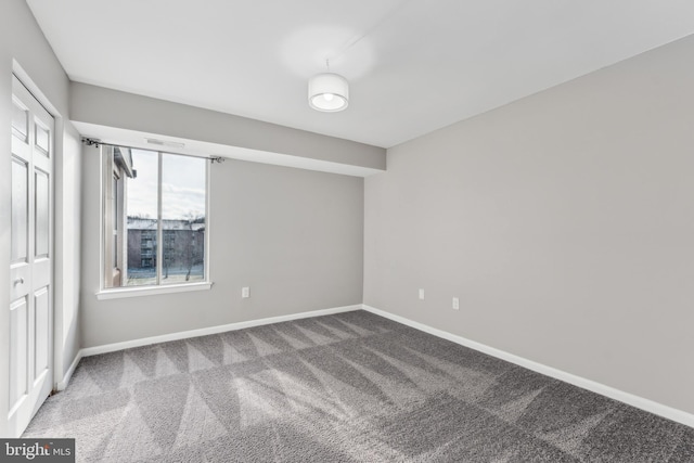 empty room featuring carpet flooring