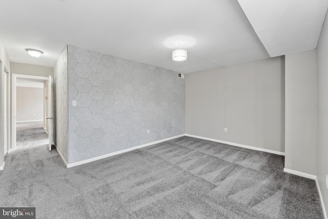 unfurnished room featuring carpet