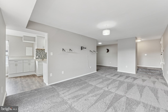 unfurnished room with light colored carpet