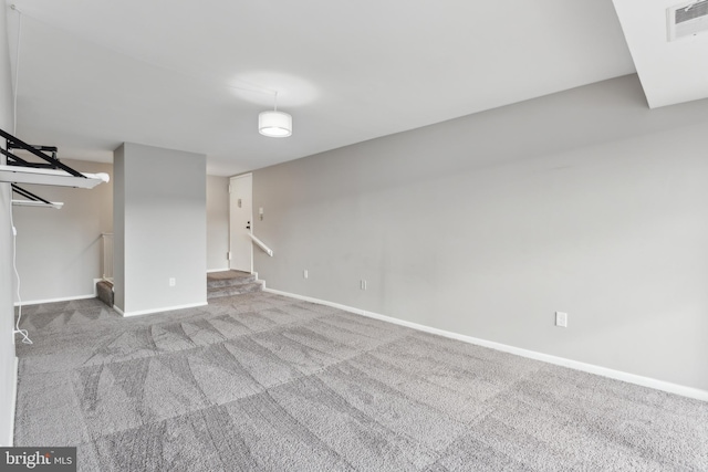 basement featuring light colored carpet