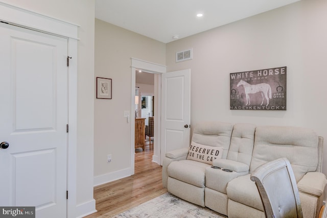 living room with light hardwood / wood-style floors