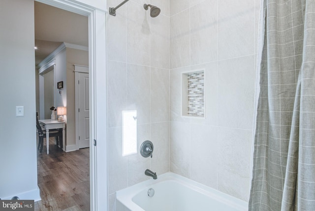 bathroom featuring crown molding, wood-type flooring, and shower / bath combo