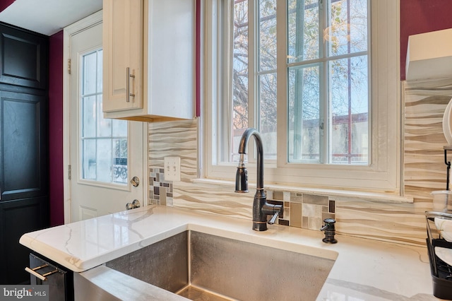 kitchen featuring a healthy amount of sunlight and sink