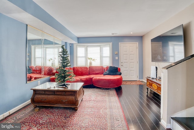 living room with dark hardwood / wood-style floors