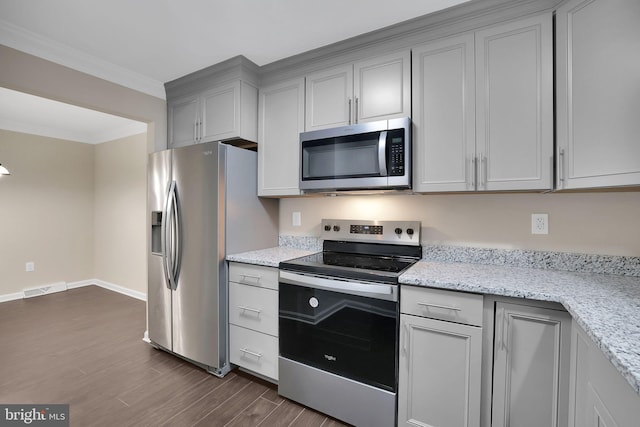 kitchen with stainless steel appliances, crown molding, dark wood-type flooring, and light stone counters