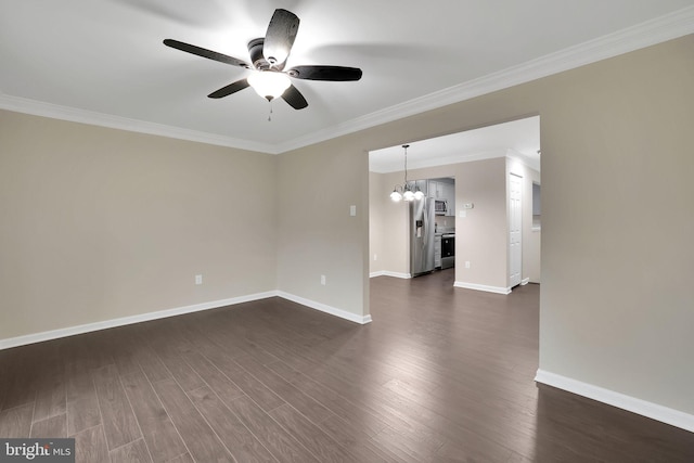 spare room featuring ceiling fan with notable chandelier, dark hardwood / wood-style flooring, and ornamental molding