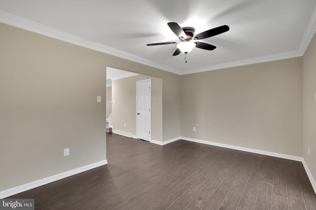 spare room with crown molding, ceiling fan, and dark wood-type flooring