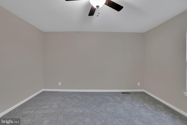 unfurnished room featuring ceiling fan and carpet floors