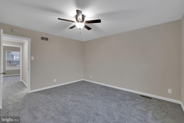 unfurnished room featuring carpet and ceiling fan