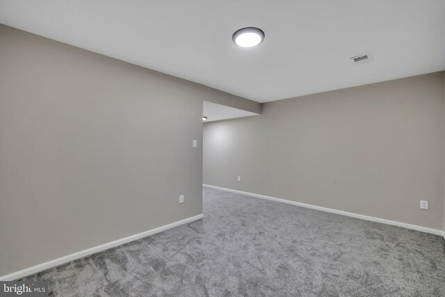 unfurnished room with carpet floors