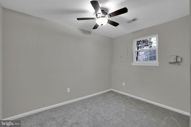 empty room featuring carpet flooring and ceiling fan