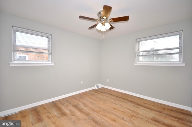 unfurnished room with ceiling fan and light hardwood / wood-style flooring