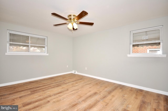 unfurnished room with ceiling fan and light hardwood / wood-style flooring