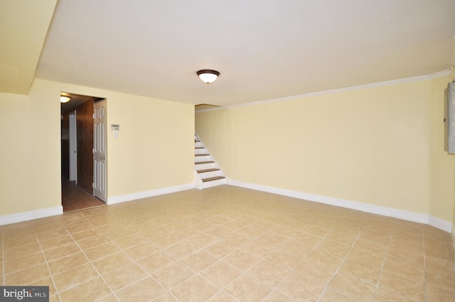 basement featuring crown molding and light tile patterned flooring