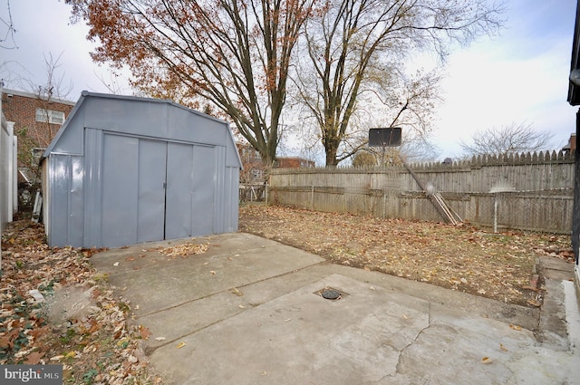 view of patio with a storage shed