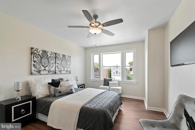 bedroom featuring ceiling fan and dark hardwood / wood-style flooring