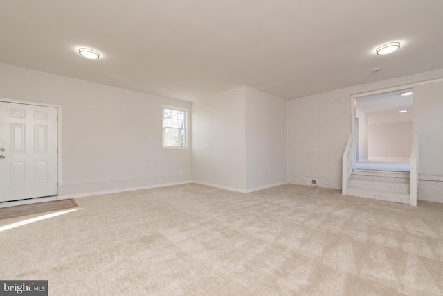 spare room with light carpet