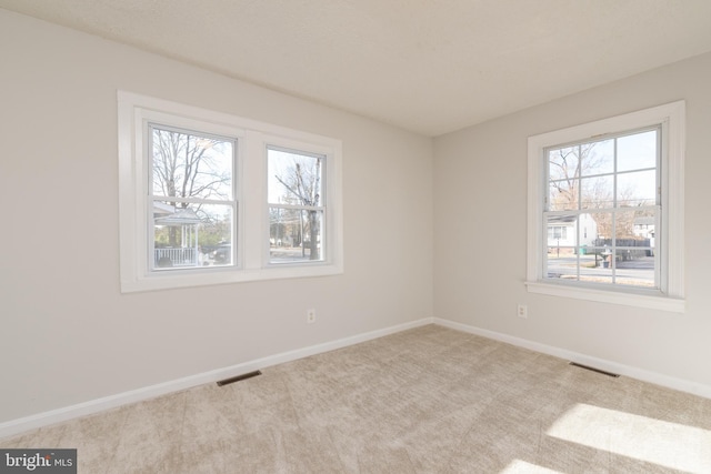 view of carpeted spare room