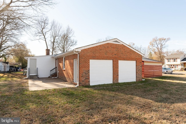 garage with a lawn