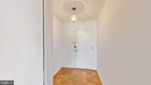 doorway featuring light parquet floors