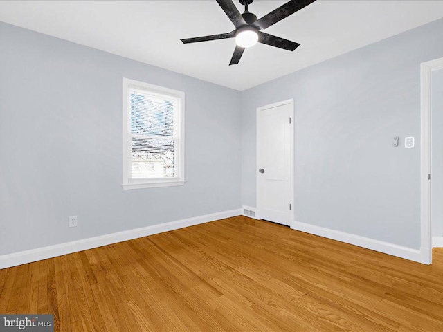 unfurnished room featuring hardwood / wood-style floors and ceiling fan