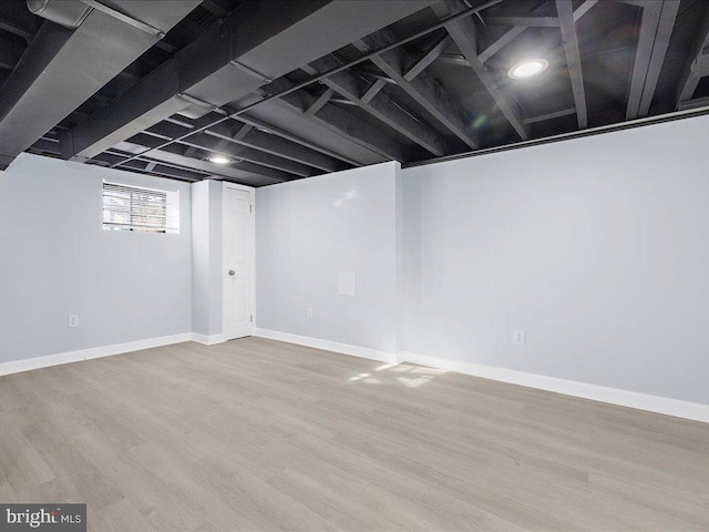 basement featuring light wood-type flooring