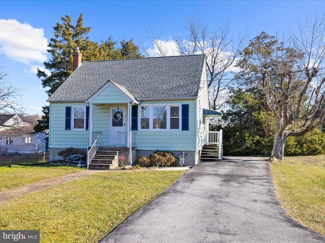 bungalow-style home with a front yard