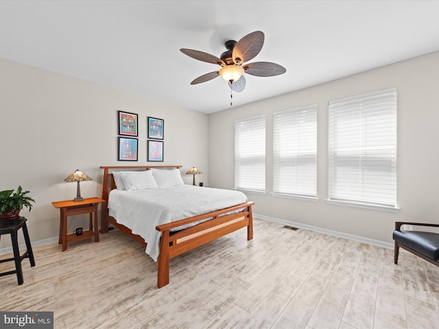 bedroom featuring light hardwood / wood-style floors and ceiling fan