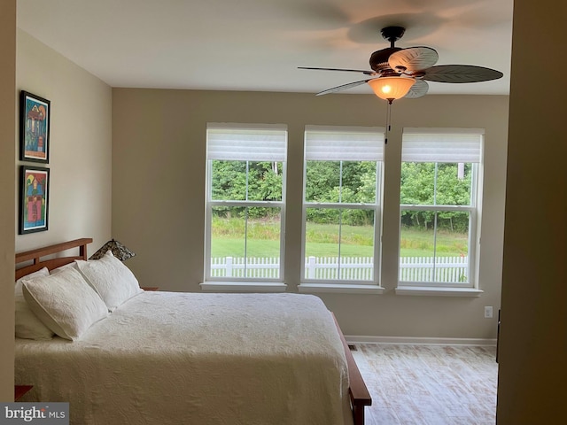 bedroom featuring hardwood / wood-style flooring and ceiling fan