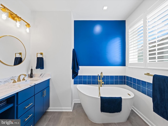 bathroom with vanity and a bathing tub