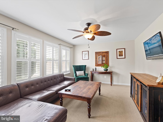 living room with light carpet and ceiling fan