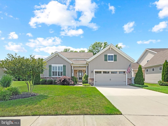 view of front of property featuring a front lawn and a garage