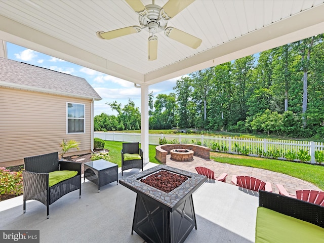 view of patio featuring ceiling fan and an outdoor fire pit