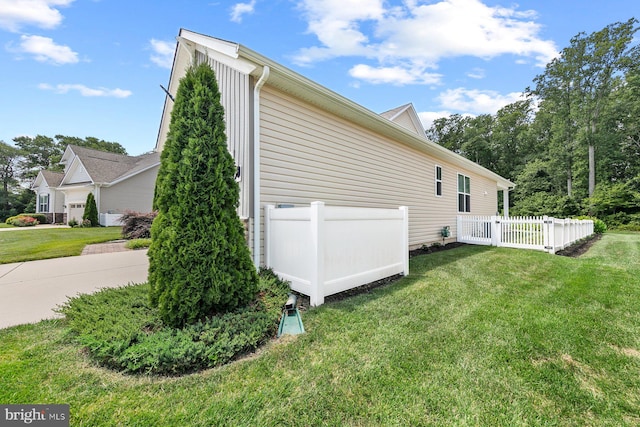 view of property exterior featuring a lawn