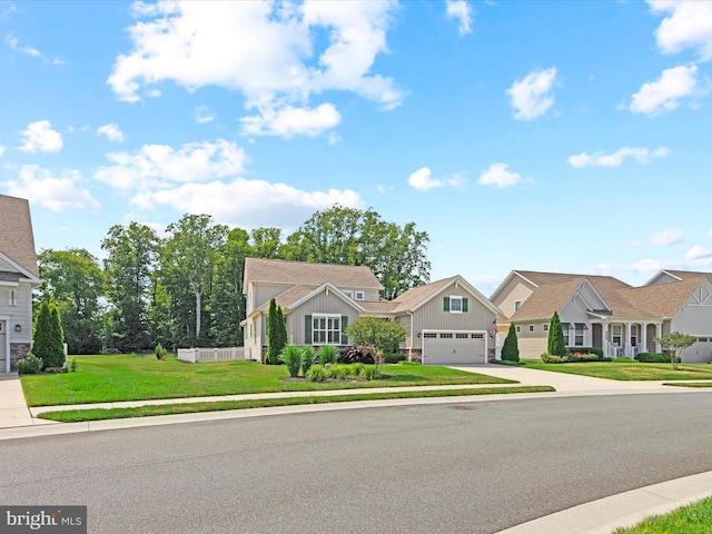 view of front of property with a front lawn and a garage