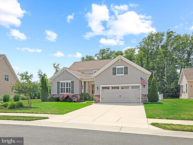 view of front facade with a front yard and a garage