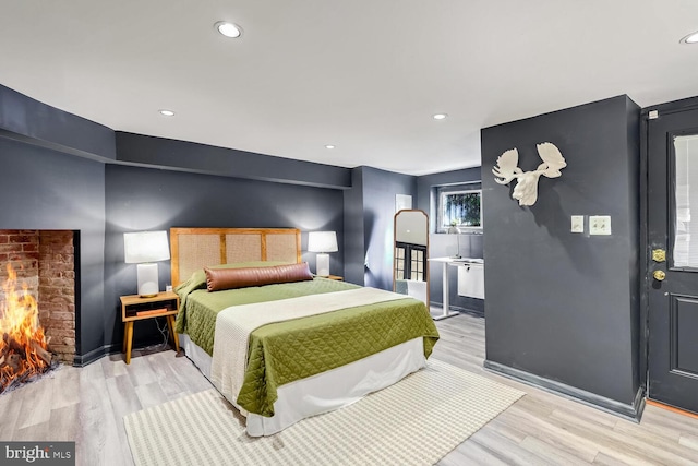 bedroom with light wood-type flooring