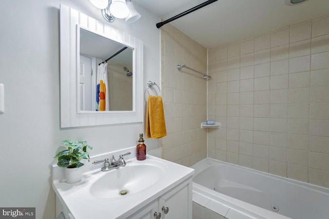 bathroom with vanity and tiled shower / bath