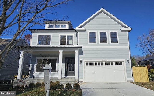 view of front of home with a garage and a porch