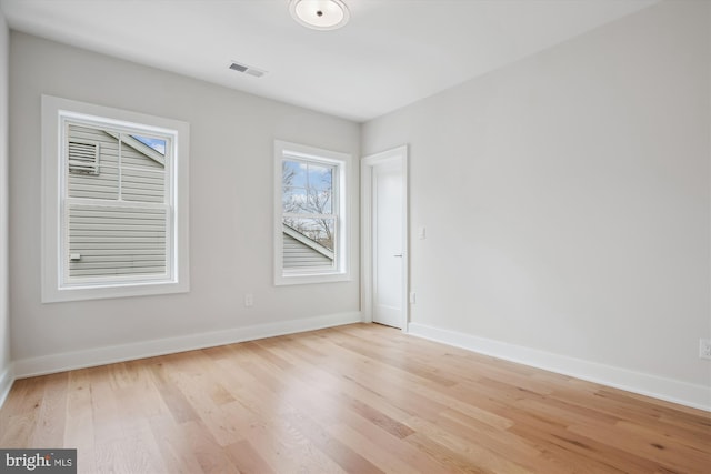 spare room featuring light hardwood / wood-style flooring