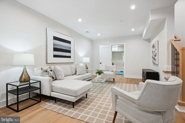 living room with light hardwood / wood-style flooring