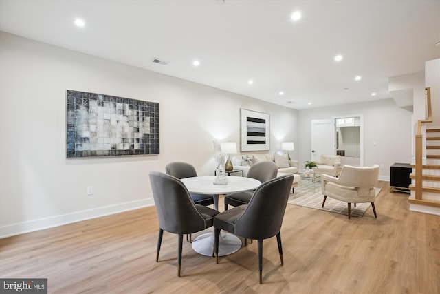 dining room with light wood-type flooring