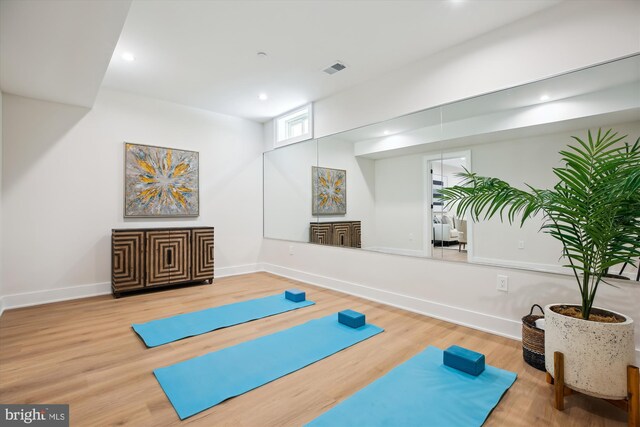 exercise area featuring hardwood / wood-style floors