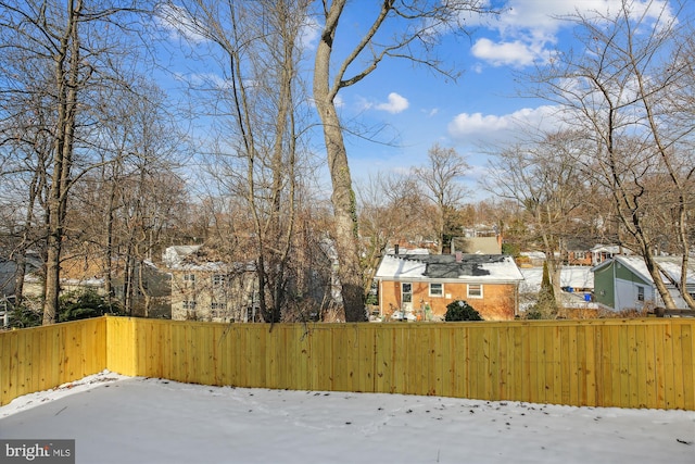 view of yard covered in snow