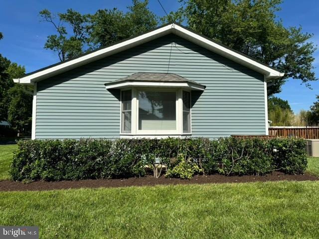 view of home's exterior featuring a yard