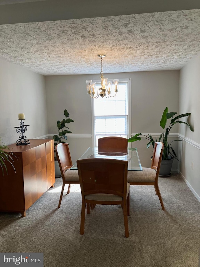 carpeted dining space with a notable chandelier