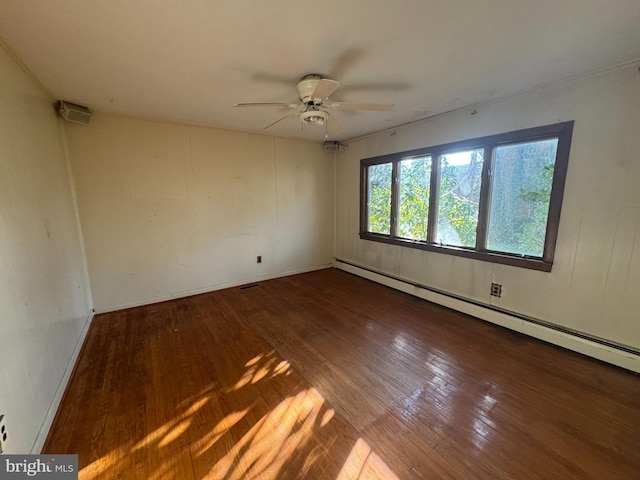 unfurnished room with ceiling fan, wood-type flooring, and a baseboard radiator